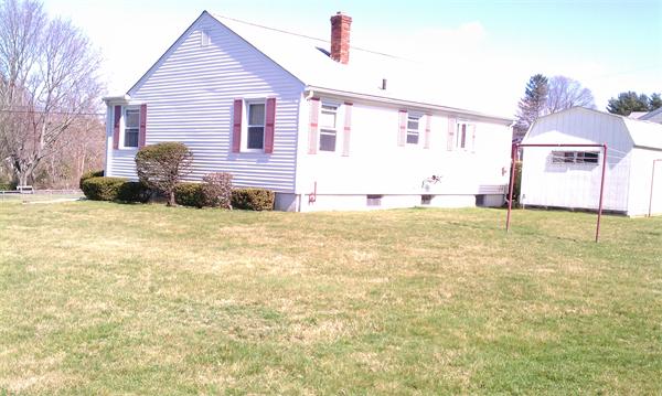 83 Lepes Road Tiverton, RI 02878 - Photo 5 of 5 a view of a house with a yard