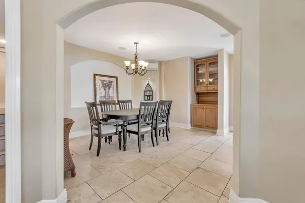 a view of a dining room with furniture window and outside view