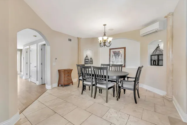 a view of a dining room with furniture window and outside view