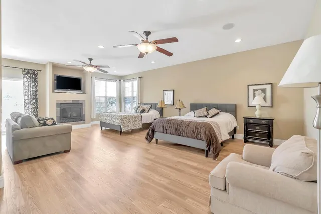 a living room with a fireplace and a flat screen tv
