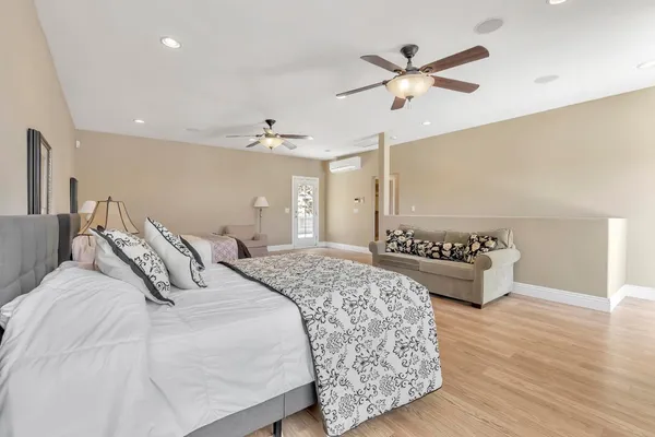 a kitchen with white cabinets and a sink