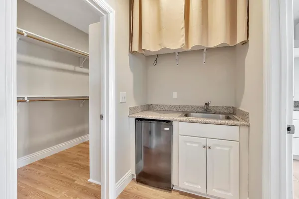 a bathroom with a tub and a window