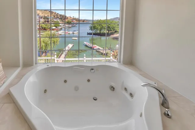 a bathroom with a tub and a window