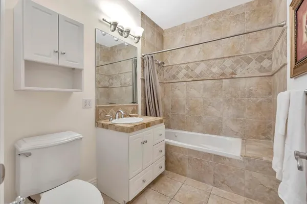 a view of a house with pool and sitting area