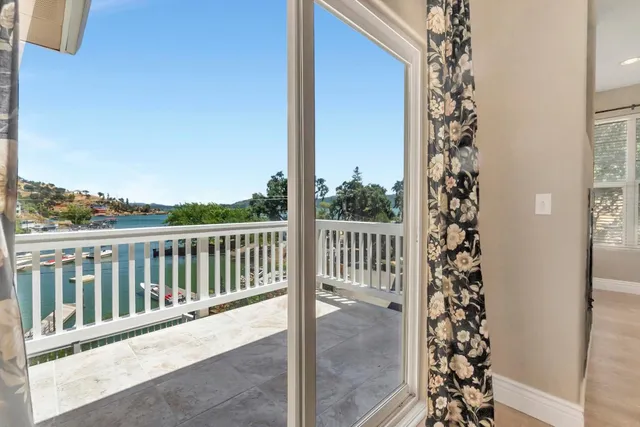 a balcony with trees in front of it