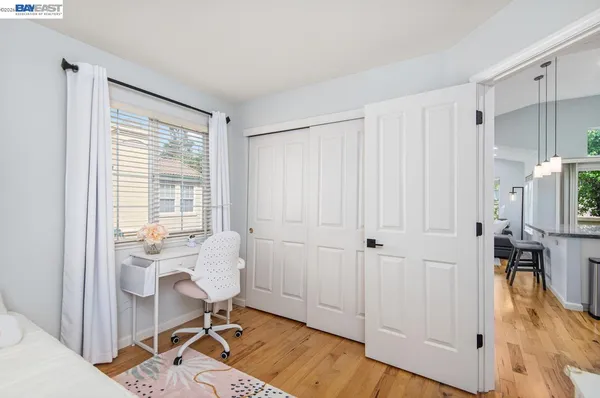 a workspace with wooden floor and a window
