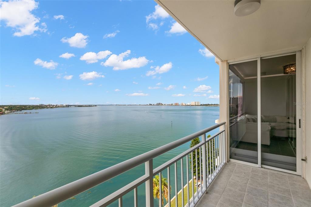 a view of a balcony next to a lake view