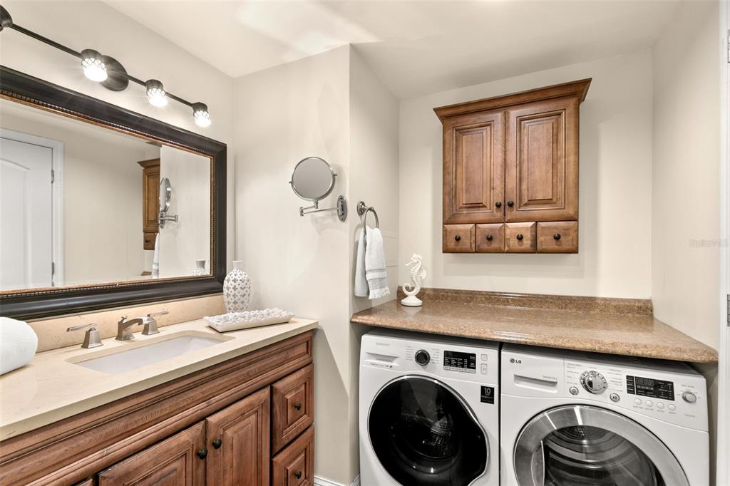 100 Pierce Street, Unit 1007 Clearwater, FL 33756 - Photo 21 of 40 a utility room with sink dryer and washer