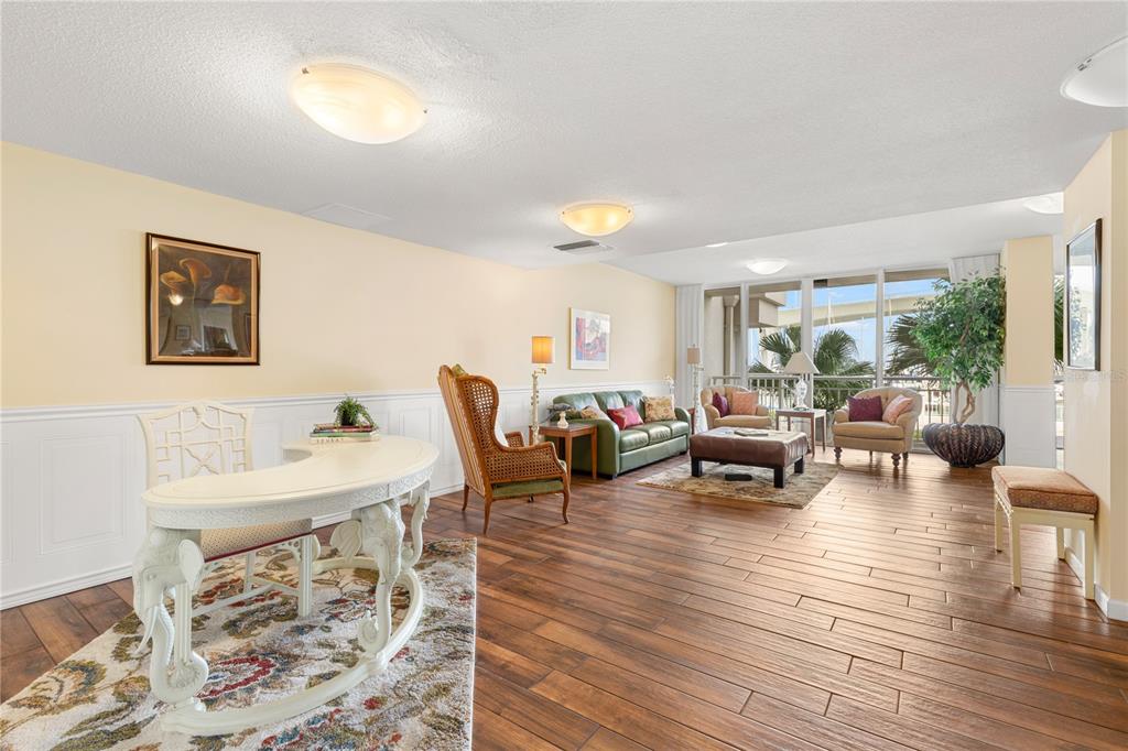100 Pierce Street, Unit 1007 Clearwater, FL 33756 - Photo 31 of 40 a living room with furniture and a wooden floor