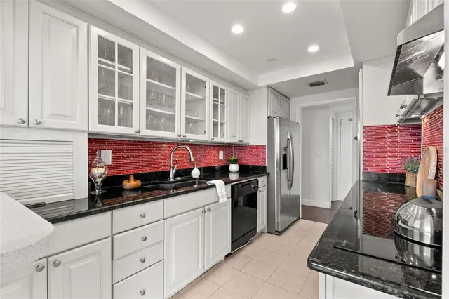 a kitchen with a stove and a refrigerator