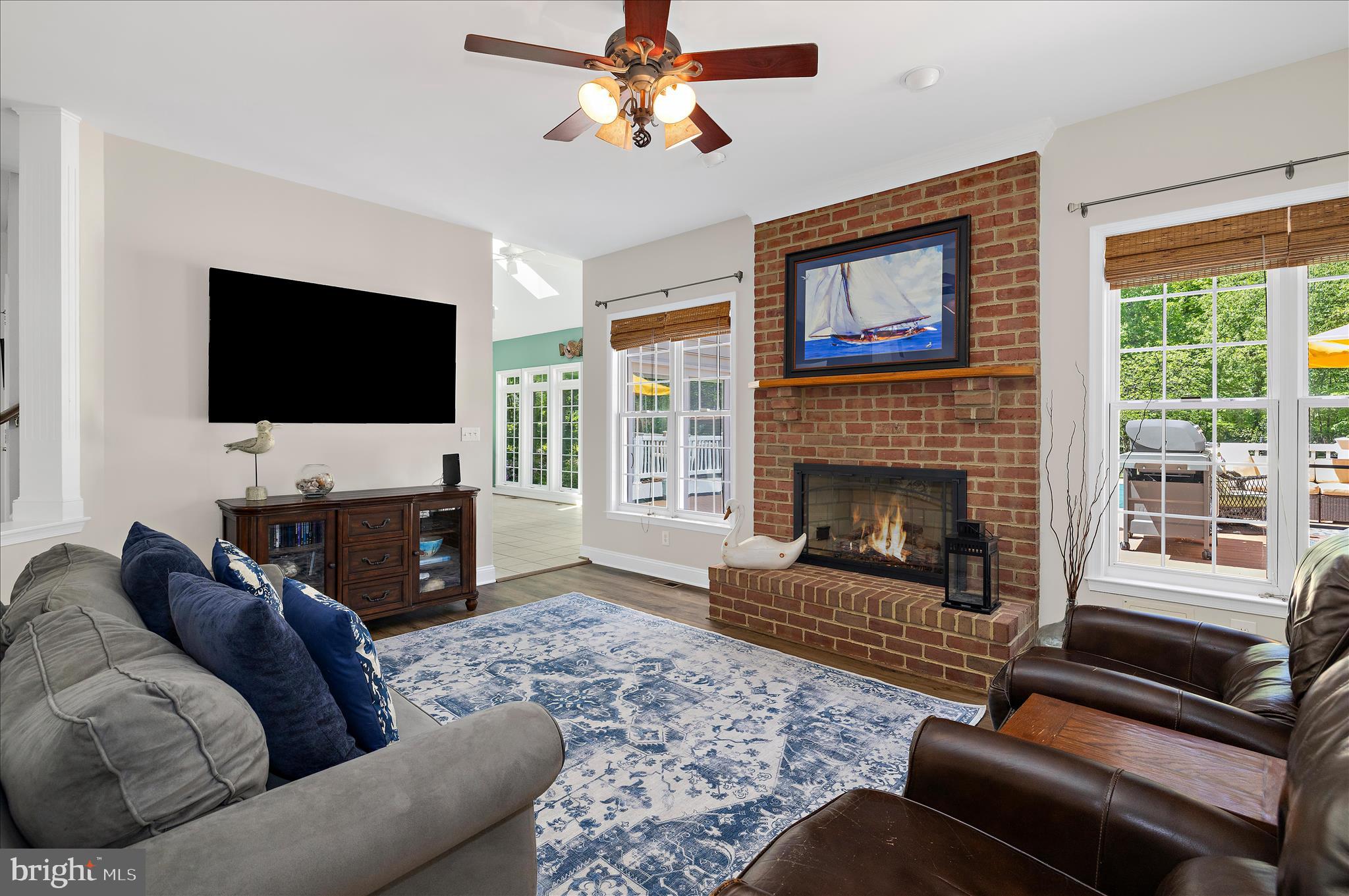 470 Jumpers Hole Road Severna Park, MD 21146 - Photo 19 of 72 a living room with furniture a flat screen tv and a fireplace