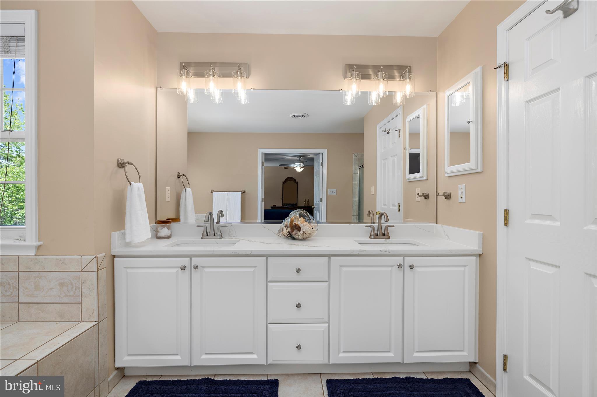 470 Jumpers Hole Road Severna Park, MD 21146 - Photo 37 of 72 a bathroom with a double vanity sink and a mirror