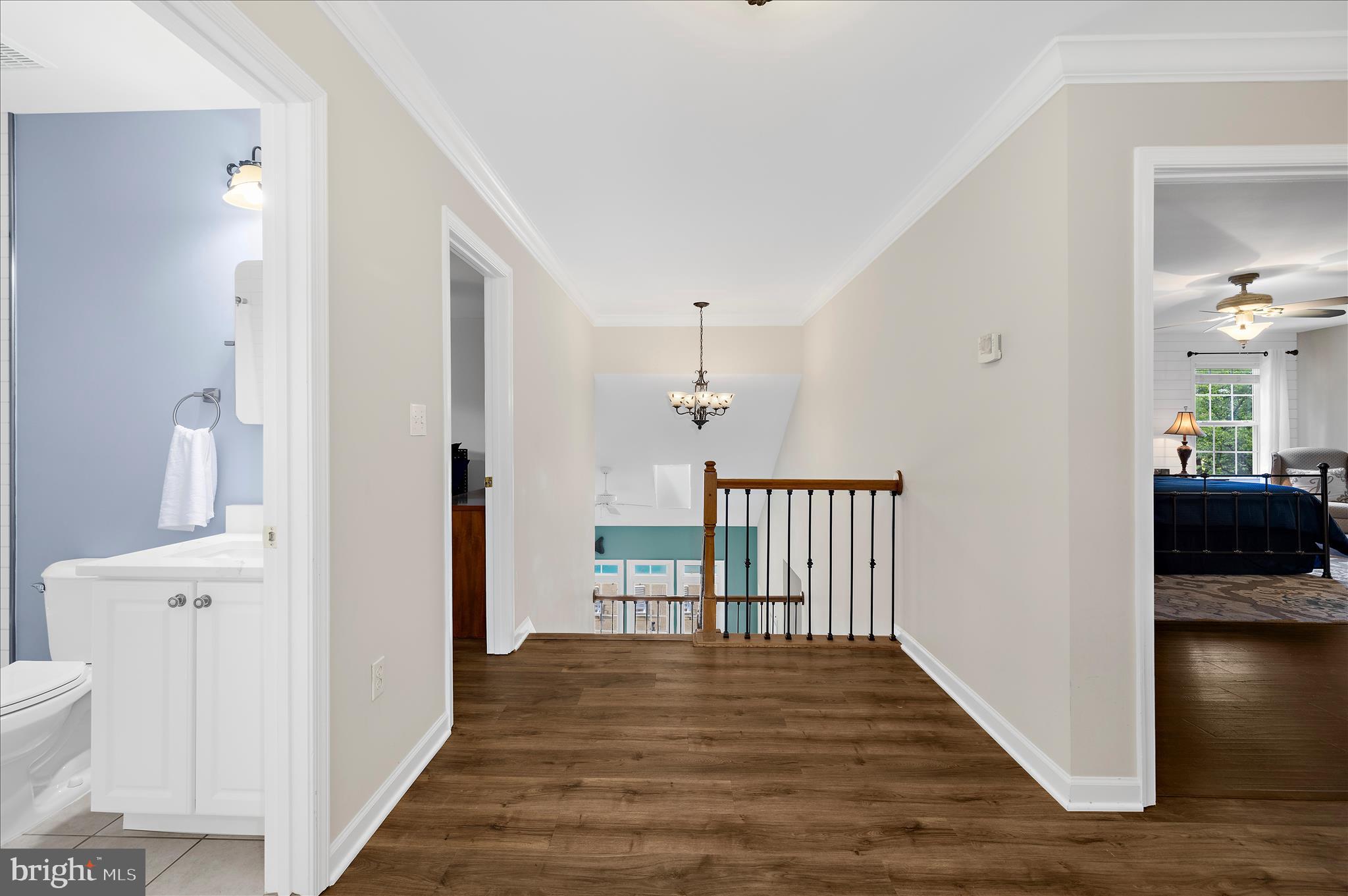 470 Jumpers Hole Road Severna Park, MD 21146 - Photo 42 of 72 a view of a hallway with wooden floor and a living room