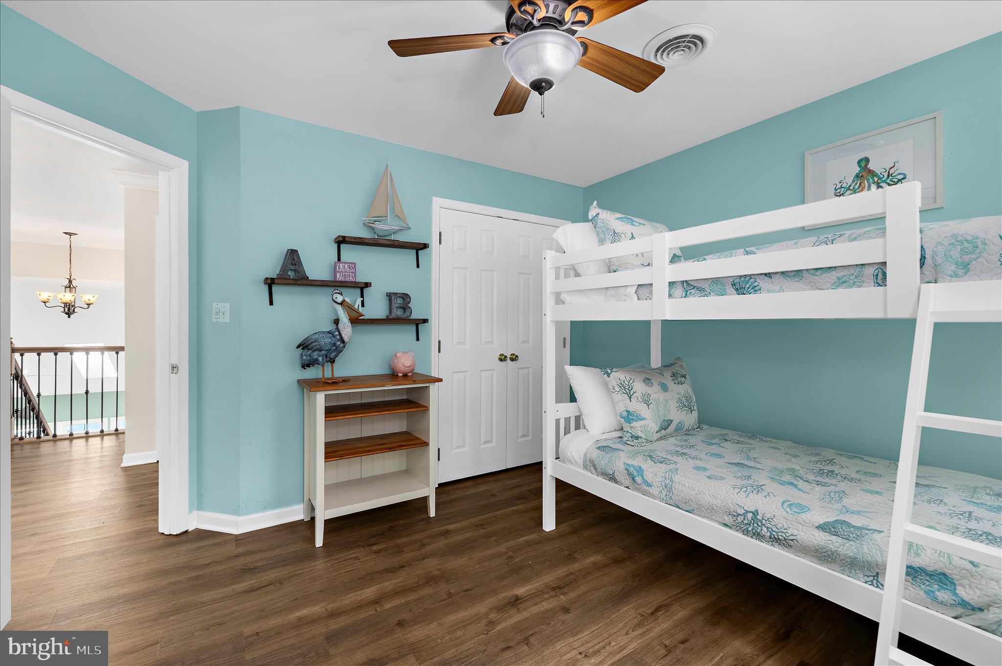 470 Jumpers Hole Road Severna Park, MD 21146 - Photo 46 of 72 a bedroom with a bed and a chandelier