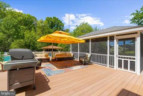 an aerial view of a house with a yard basket ball court and outdoor seating