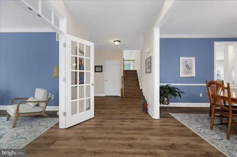 a view of a livingroom with furniture and staircase