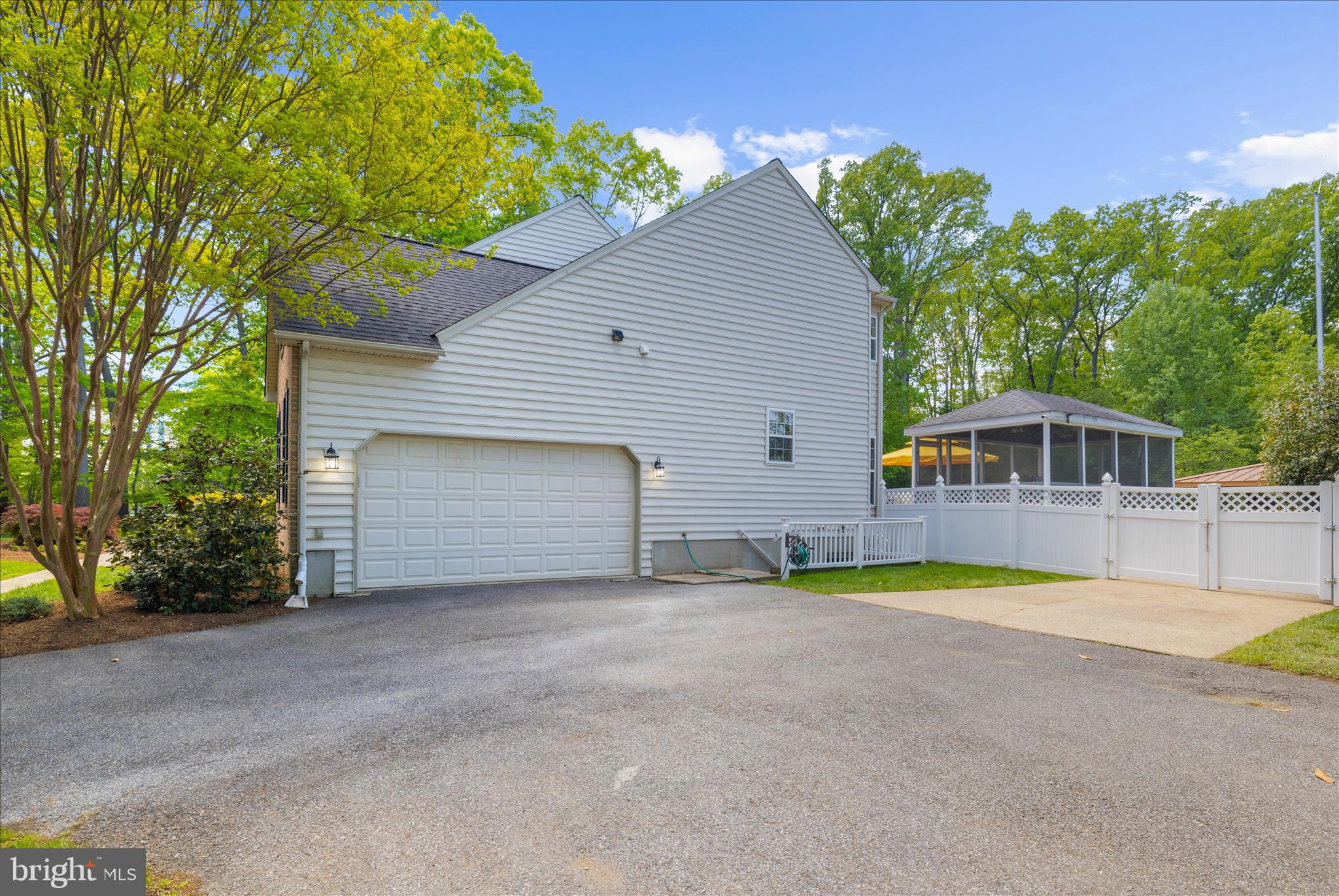470 Jumpers Hole Road Severna Park, MD 21146 - Photo 63 of 72 a view of a house with pool and chairs under an umbrella
