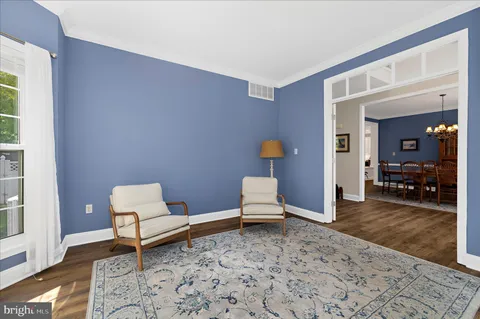 a room with furniture and wooden floor