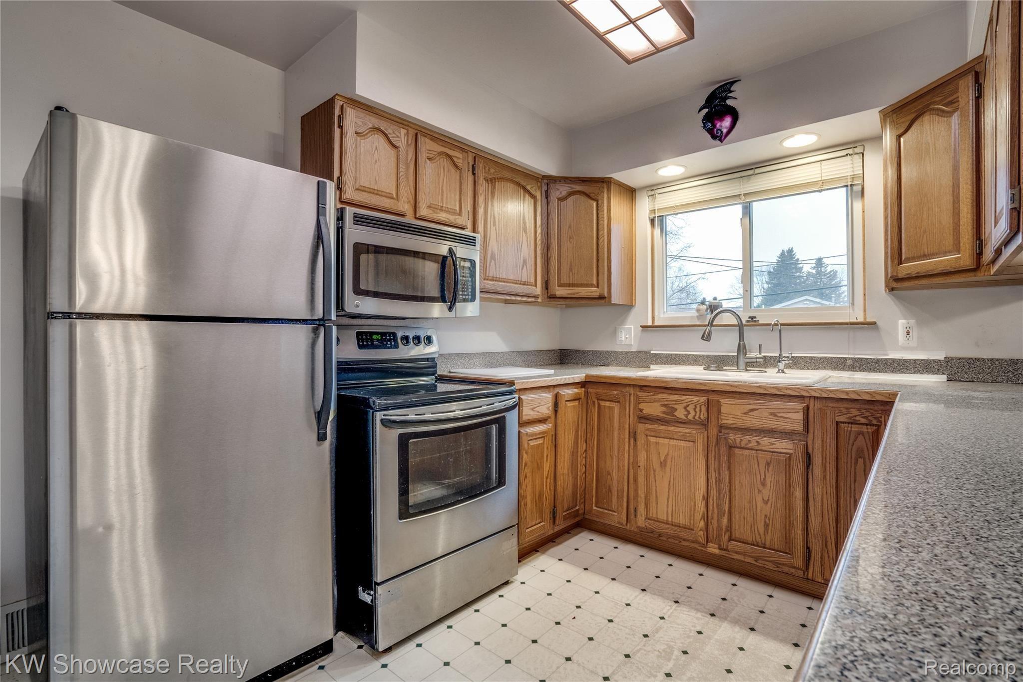 2129 Welch Road Walled Lake, MI 48390 - Photo 14 of 26 A view of the Kitchen from the end of the island.