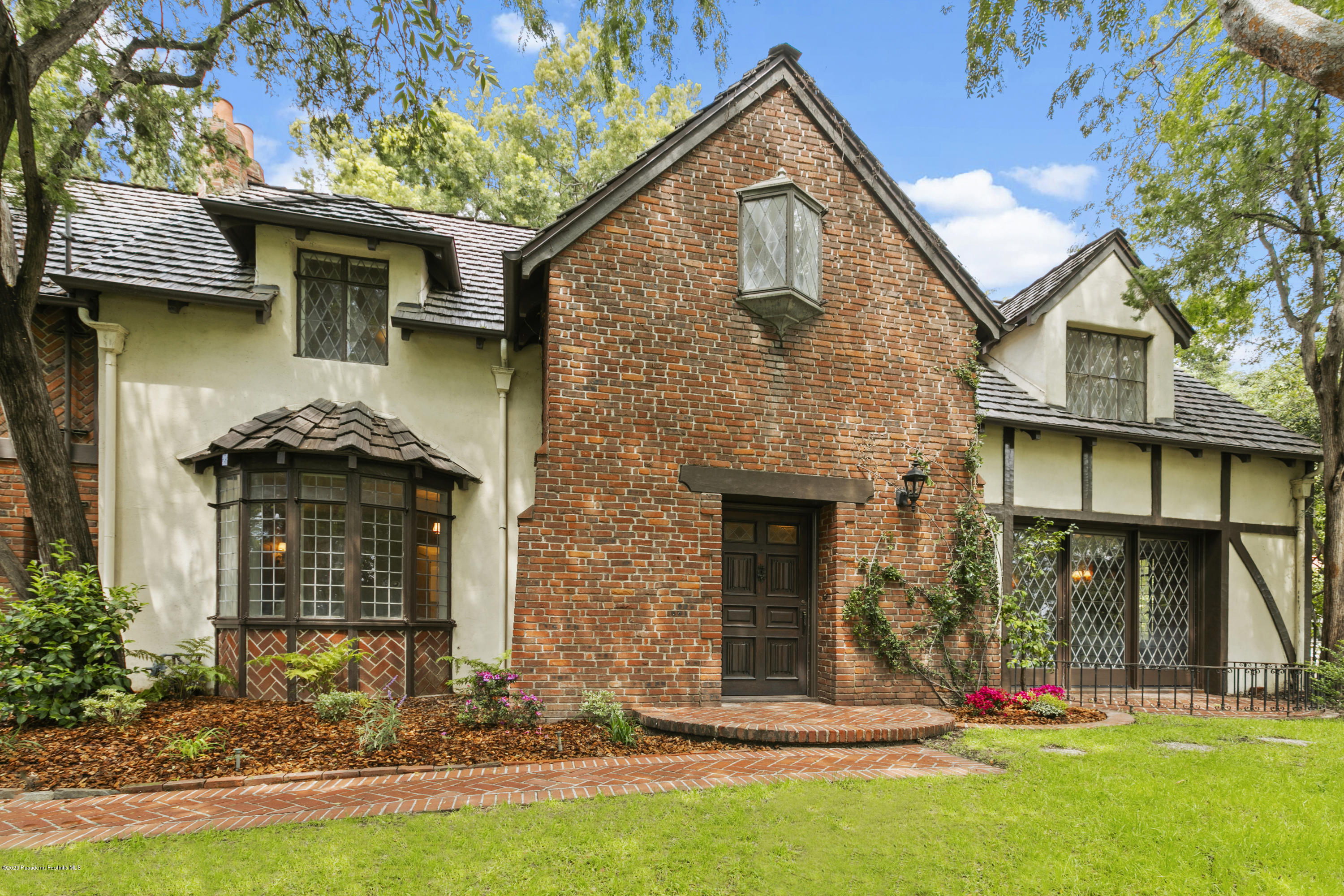 1701 East Altadena Drive Altadena, CA 91001 - Photo 2 of 36 a front view of a house with garden