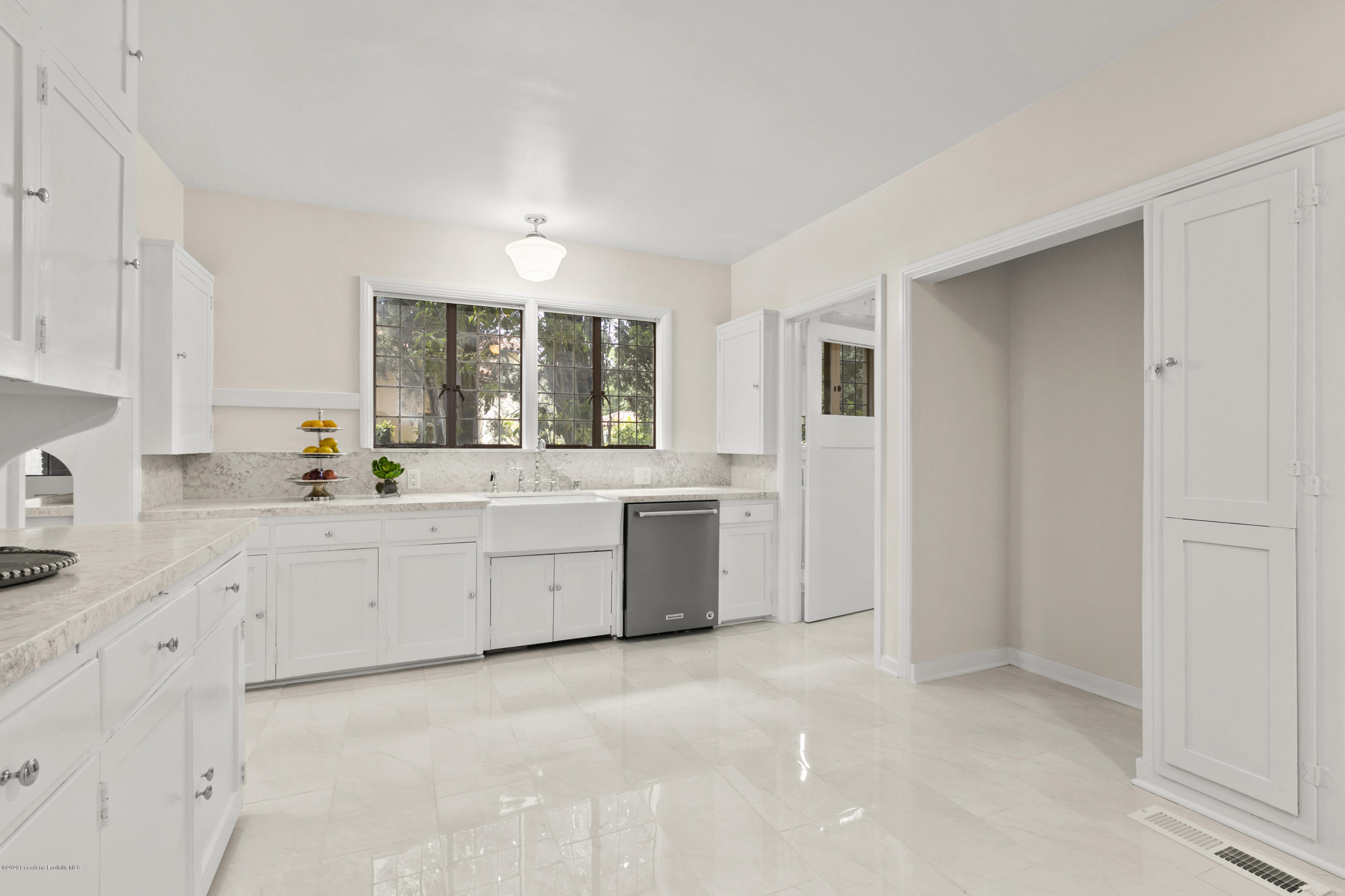 1701 East Altadena Drive Altadena, CA 91001 - Photo 13 of 36 a large white room with a large window and white cabinets