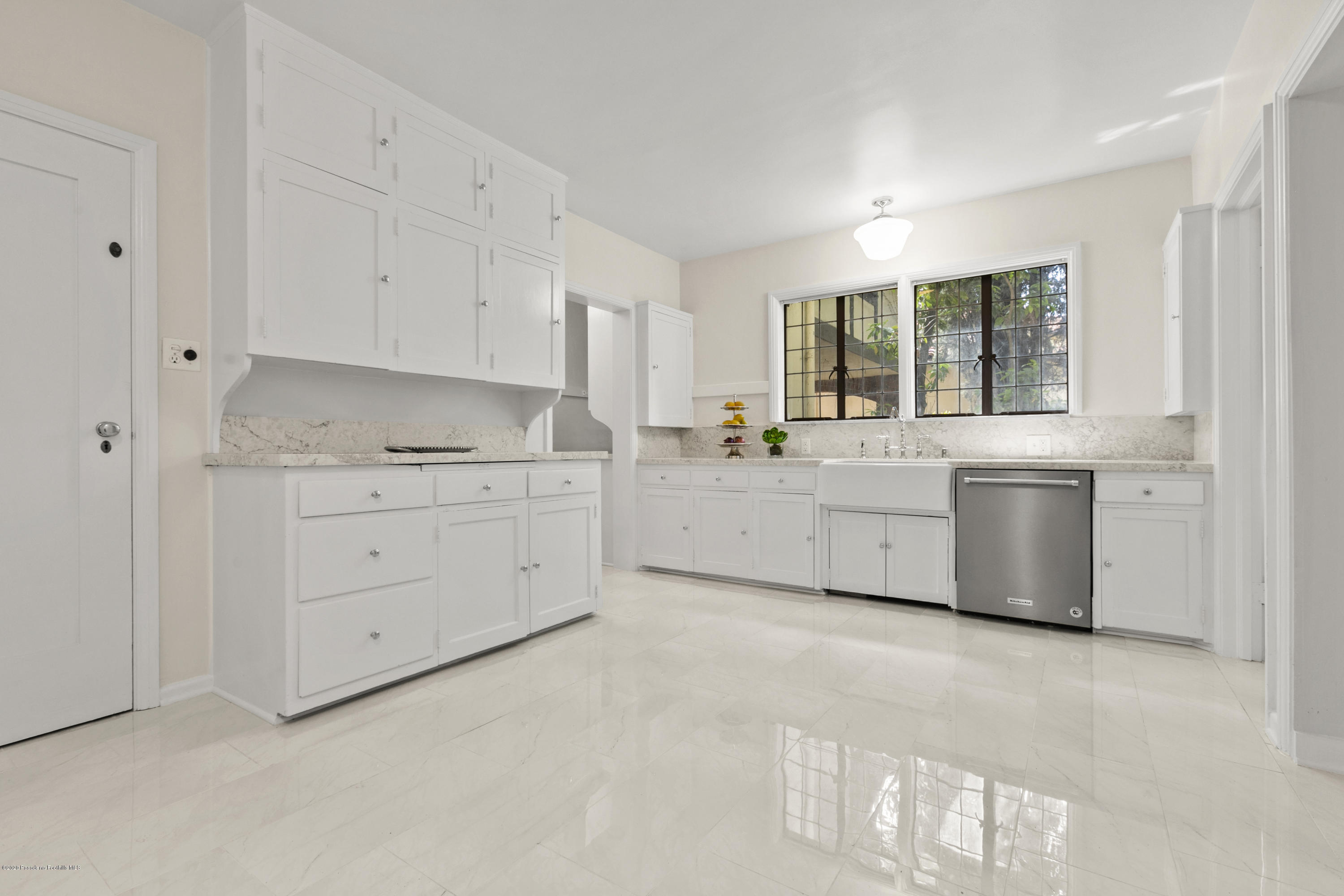 1701 East Altadena Drive Altadena, CA 91001 - Photo 14 of 36 a kitchen with white cabinets and white appliances