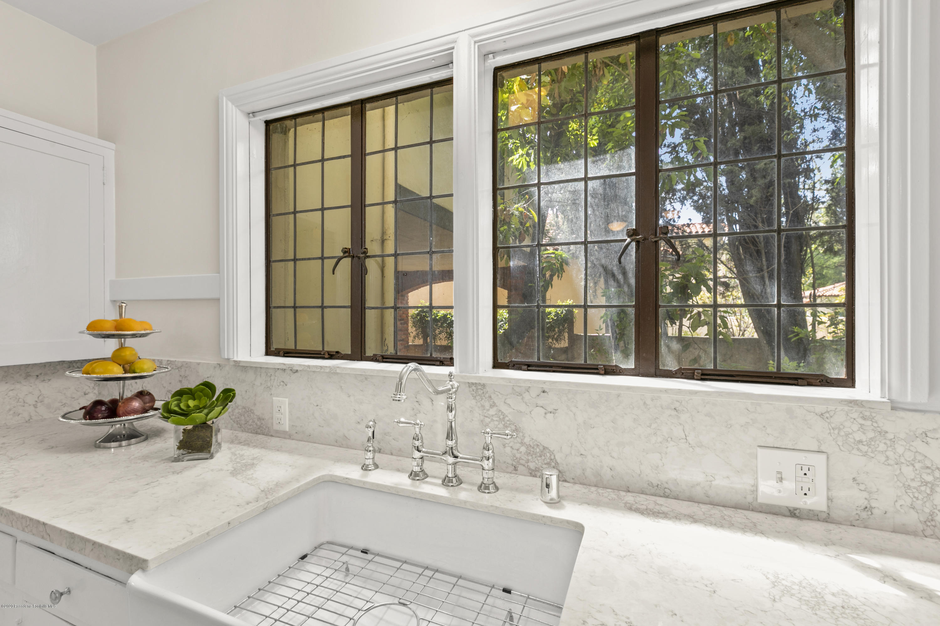 1701 East Altadena Drive Altadena, CA 91001 - Photo 15 of 36 a bathroom with a tub sink and large window