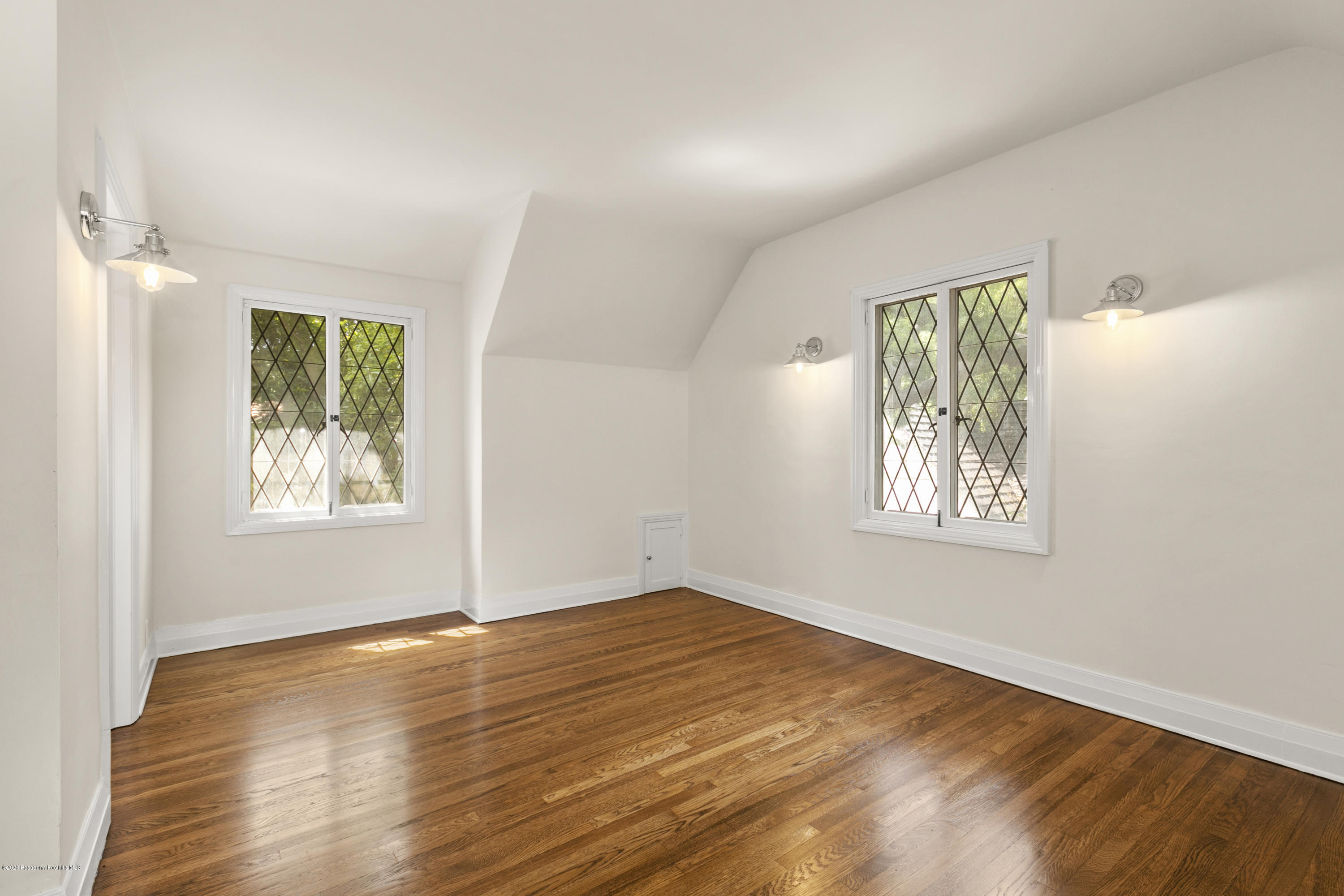 1701 East Altadena Drive Altadena, CA 91001 - Photo 21 of 36 a view of an empty room with wooden floor and a window