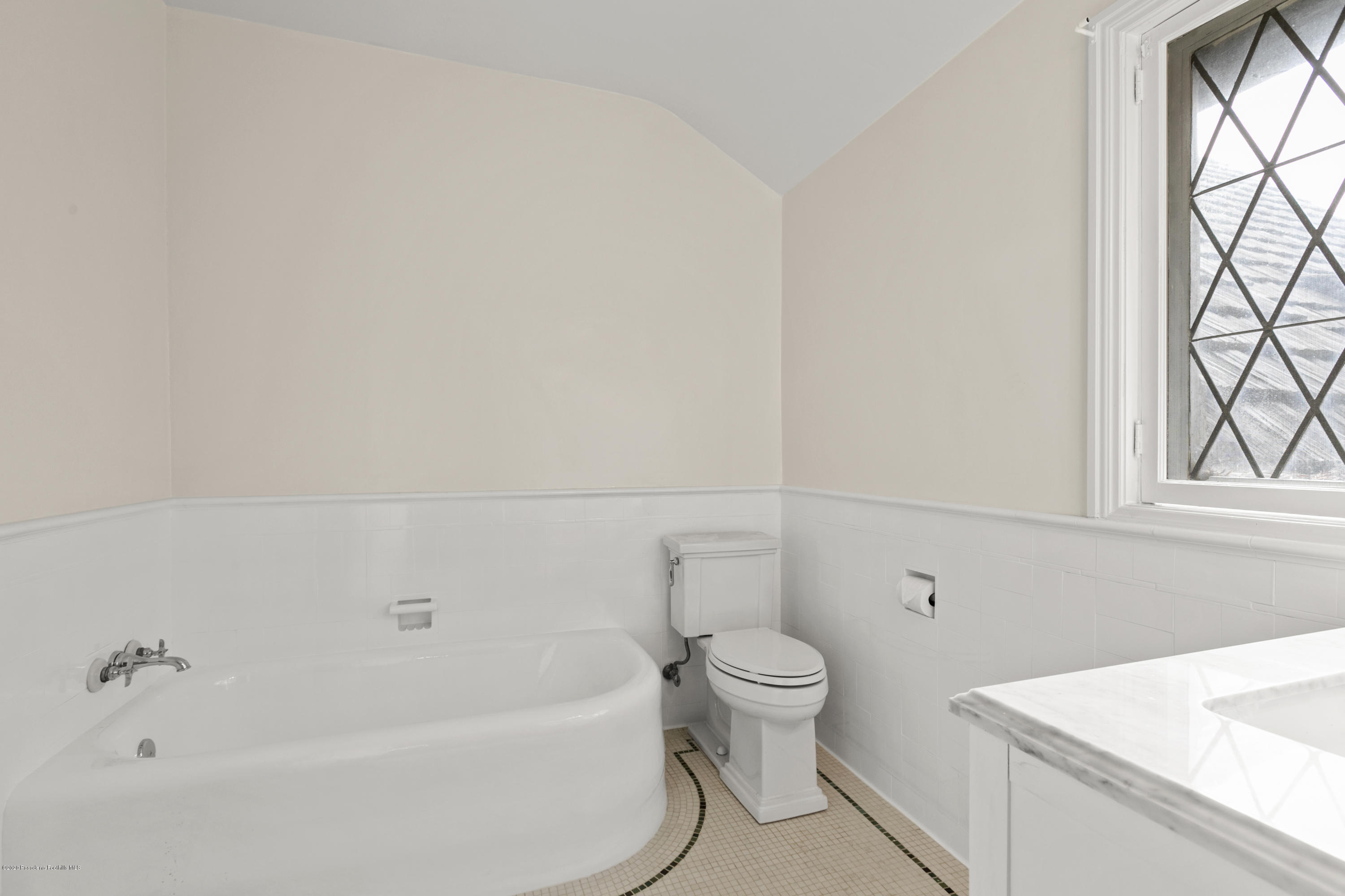 1701 East Altadena Drive Altadena, CA 91001 - Photo 23 of 36 a bathroom with a toilet and a bathtub