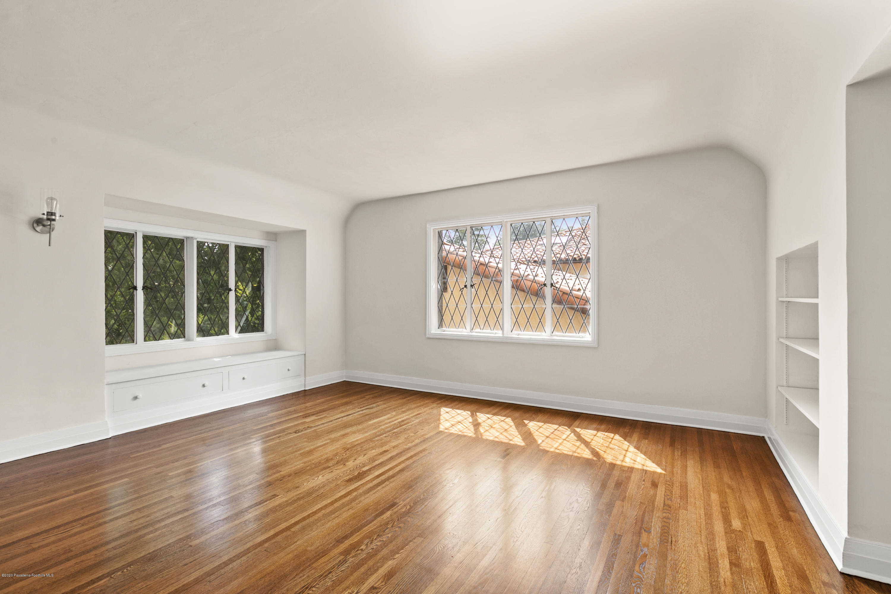 1701 East Altadena Drive Altadena, CA 91001 - Photo 29 of 36 a view of an empty room with wooden floor and a window