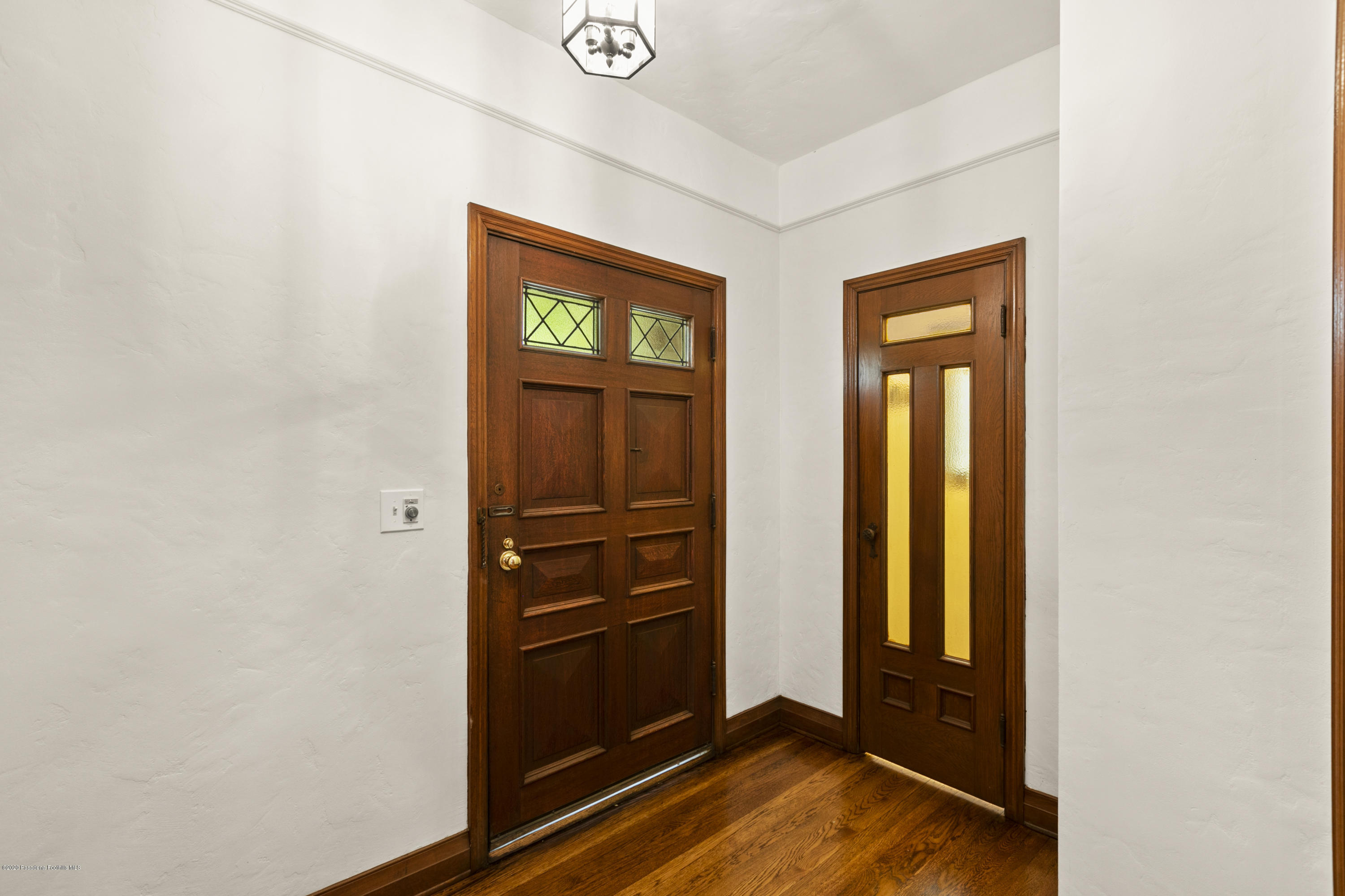 1701 East Altadena Drive Altadena, CA 91001 - Photo 4 of 36 a view of walk in closet with empty racks