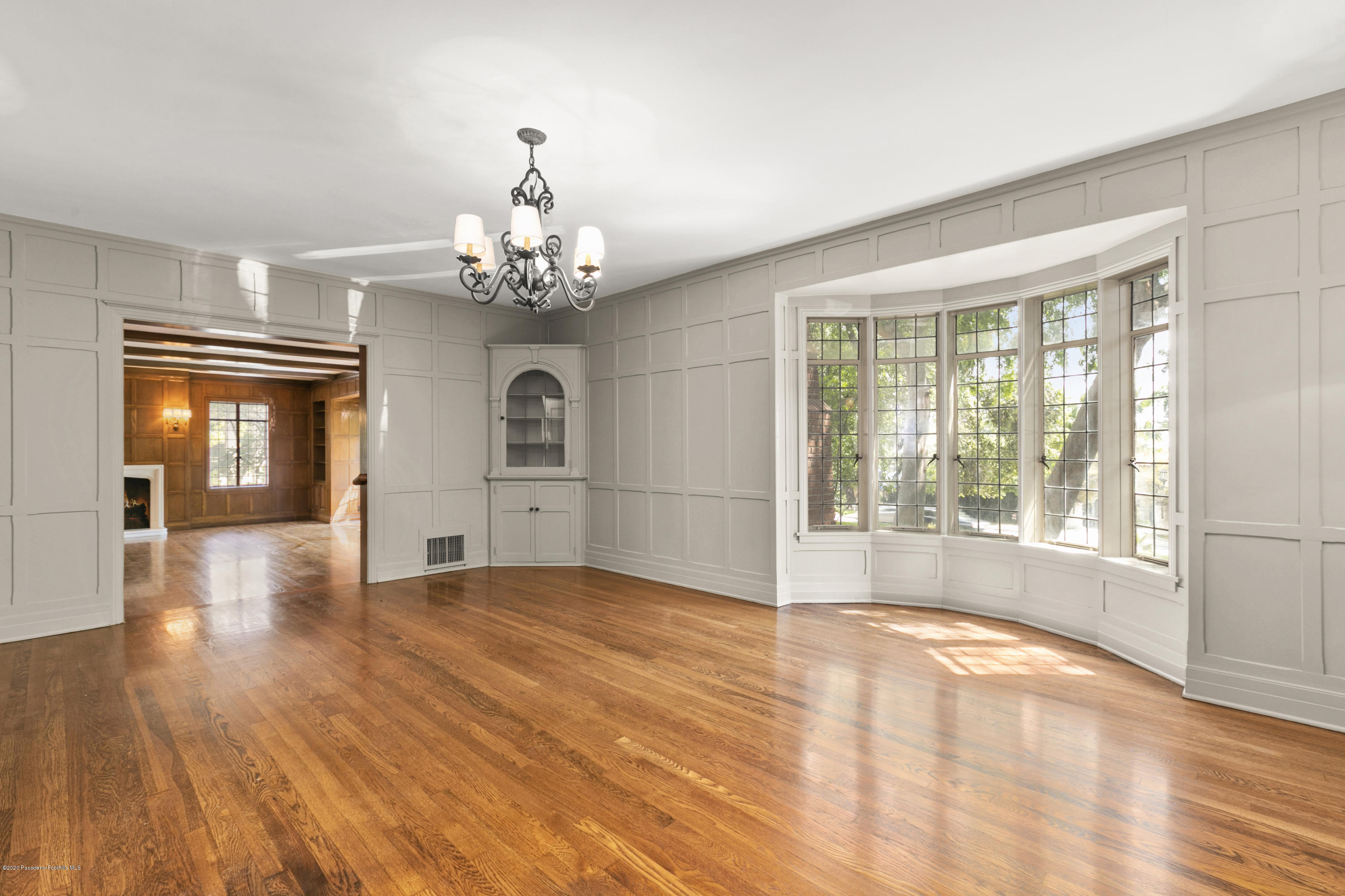 1701 East Altadena Drive Altadena, CA 91001 - Photo 10 of 36 a view of an empty room with a window and wooden floor