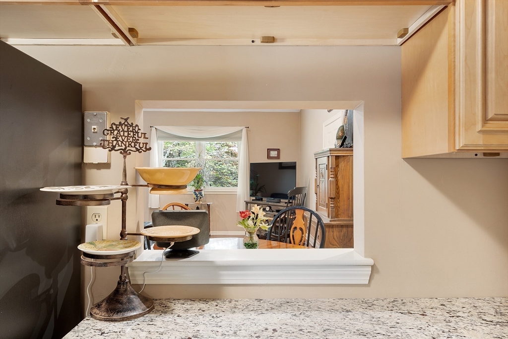 425 Main Street, Unit 8B Hudson, MA 01749 - Photo 13 of 31 a view of living room filled with furniture and a window
