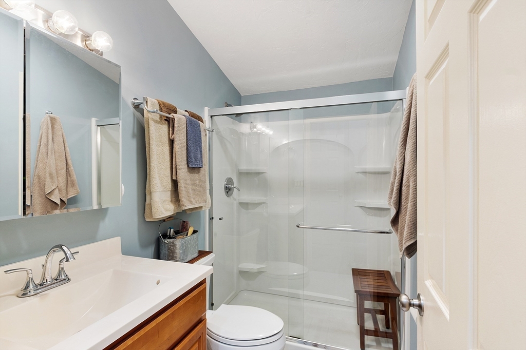 425 Main Street, Unit 8B Hudson, MA 01749 - Photo 17 of 31 a bathroom with a sink toilet and shower