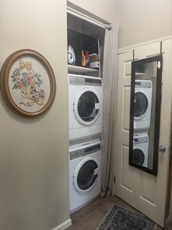 425 Main Street, Unit 8B Hudson, MA 01749 - Photo 18 of 31 a view of a bedroom with washer and dryer