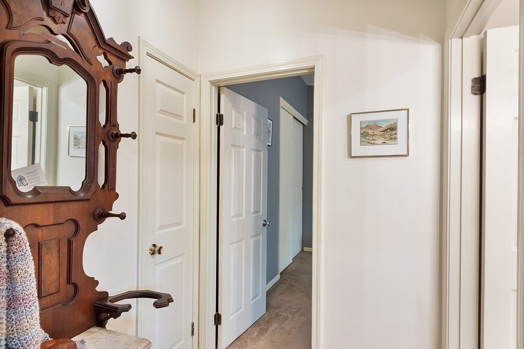 425 Main Street, Unit 8B Hudson, MA 01749 - Photo 19 of 31 a view of hallway with wooden floor