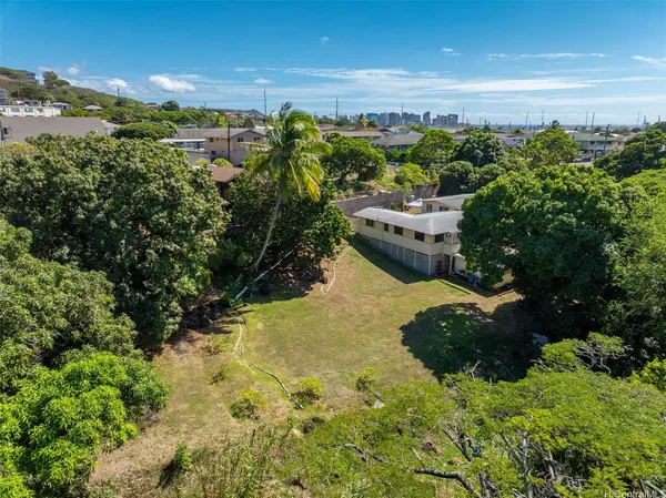 an aerial view of house with yard
