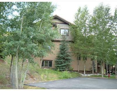 152 Knudson Ranch Road, Unit 152 Edwards, CO 81632 - Photo 2 of 6 a view of a house with a yard