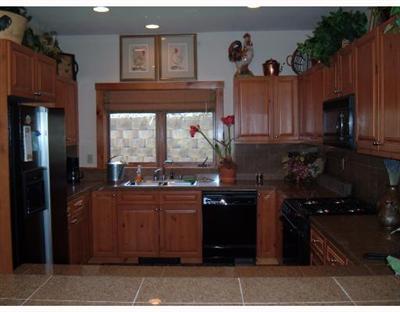 152 Knudson Ranch Road, Unit 152 Edwards, CO 81632 - Photo 6 of 6 a kitchen with a sink and cabinets