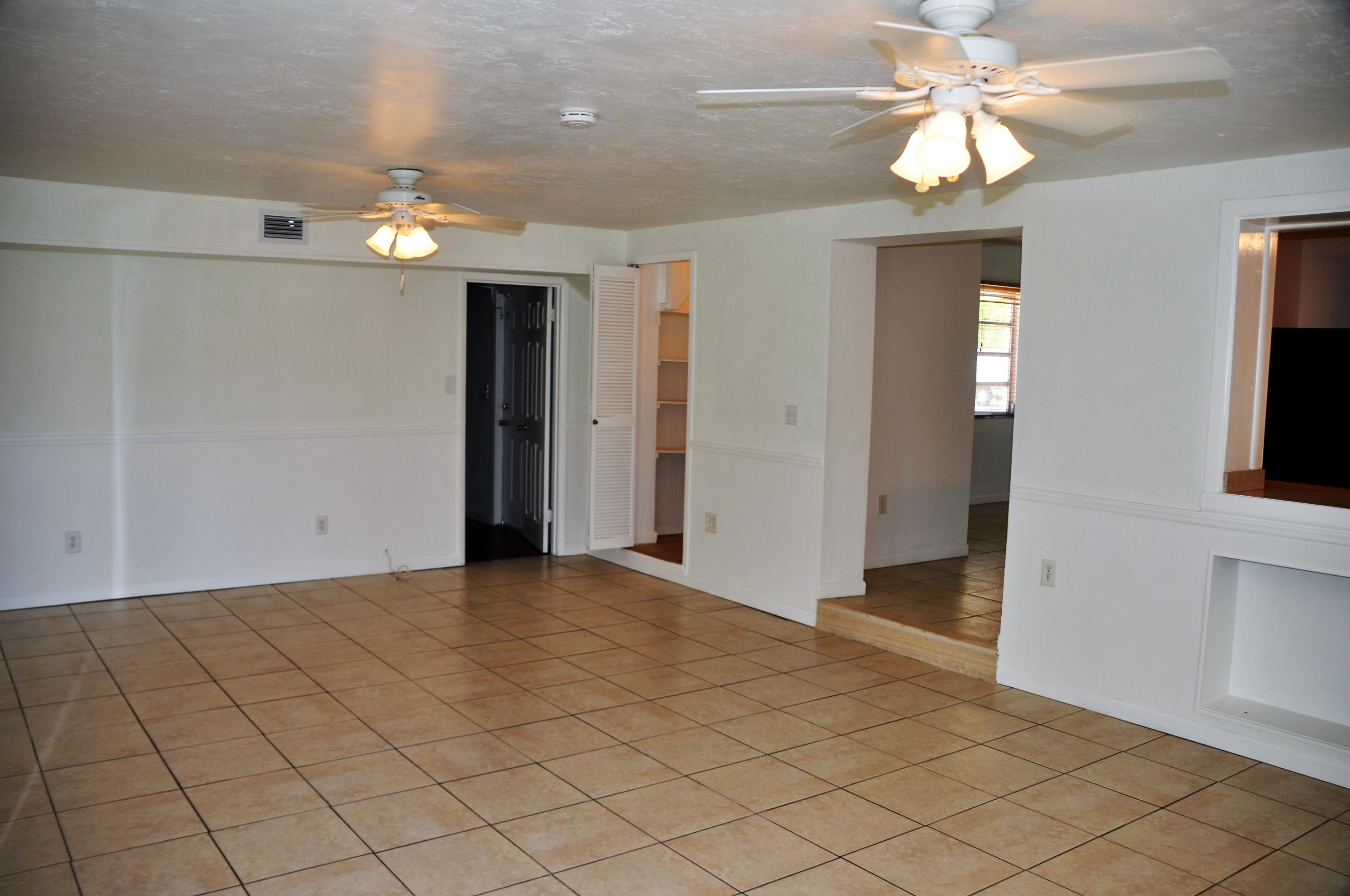 3025 Robert Road West Palm Beach, FL 33405 - Photo 11 of 41 an empty room with fan and entrance