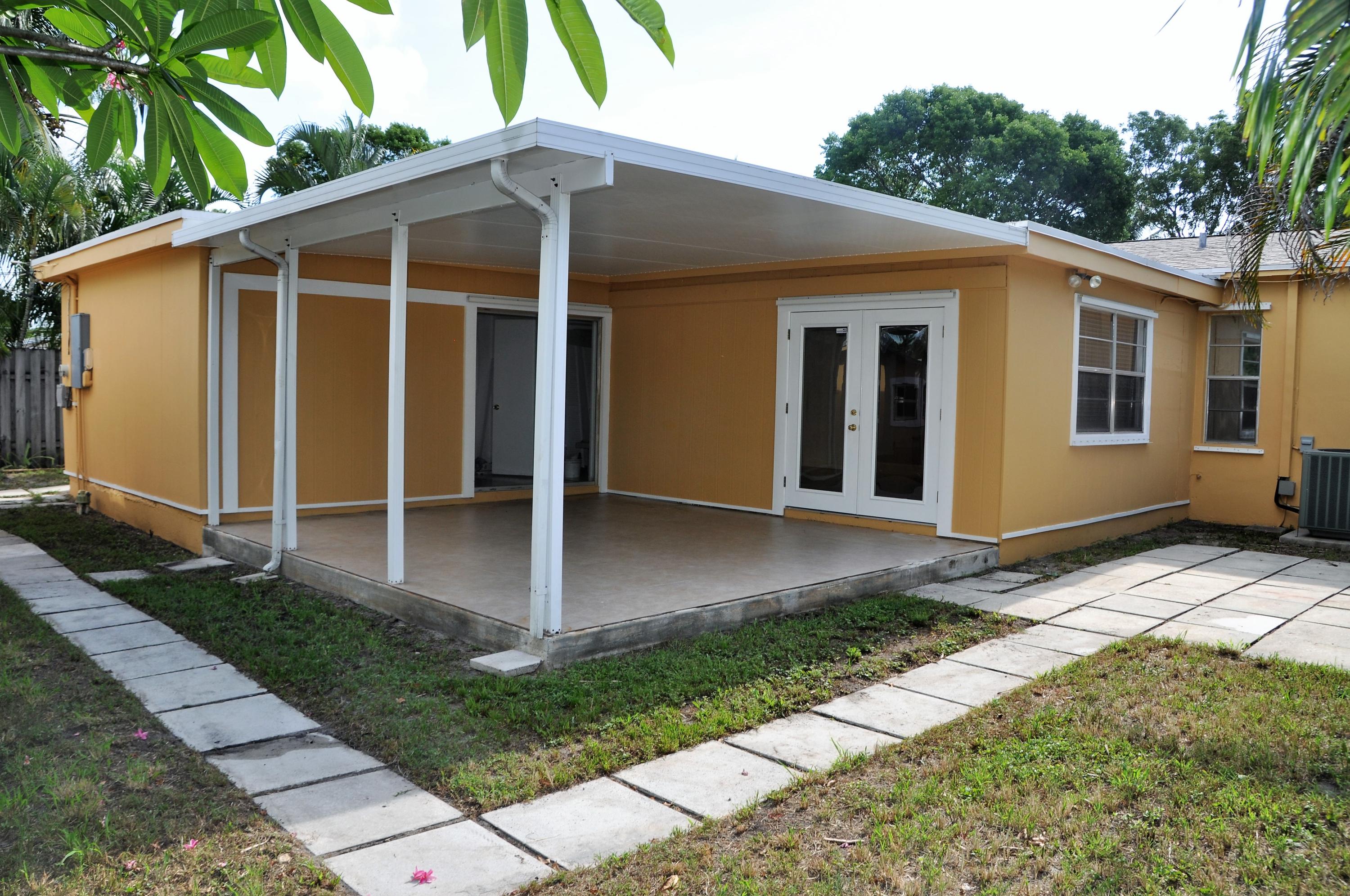 3025 Robert Road West Palm Beach, FL 33405 - Photo 12 of 41 a view of a house with backyard
