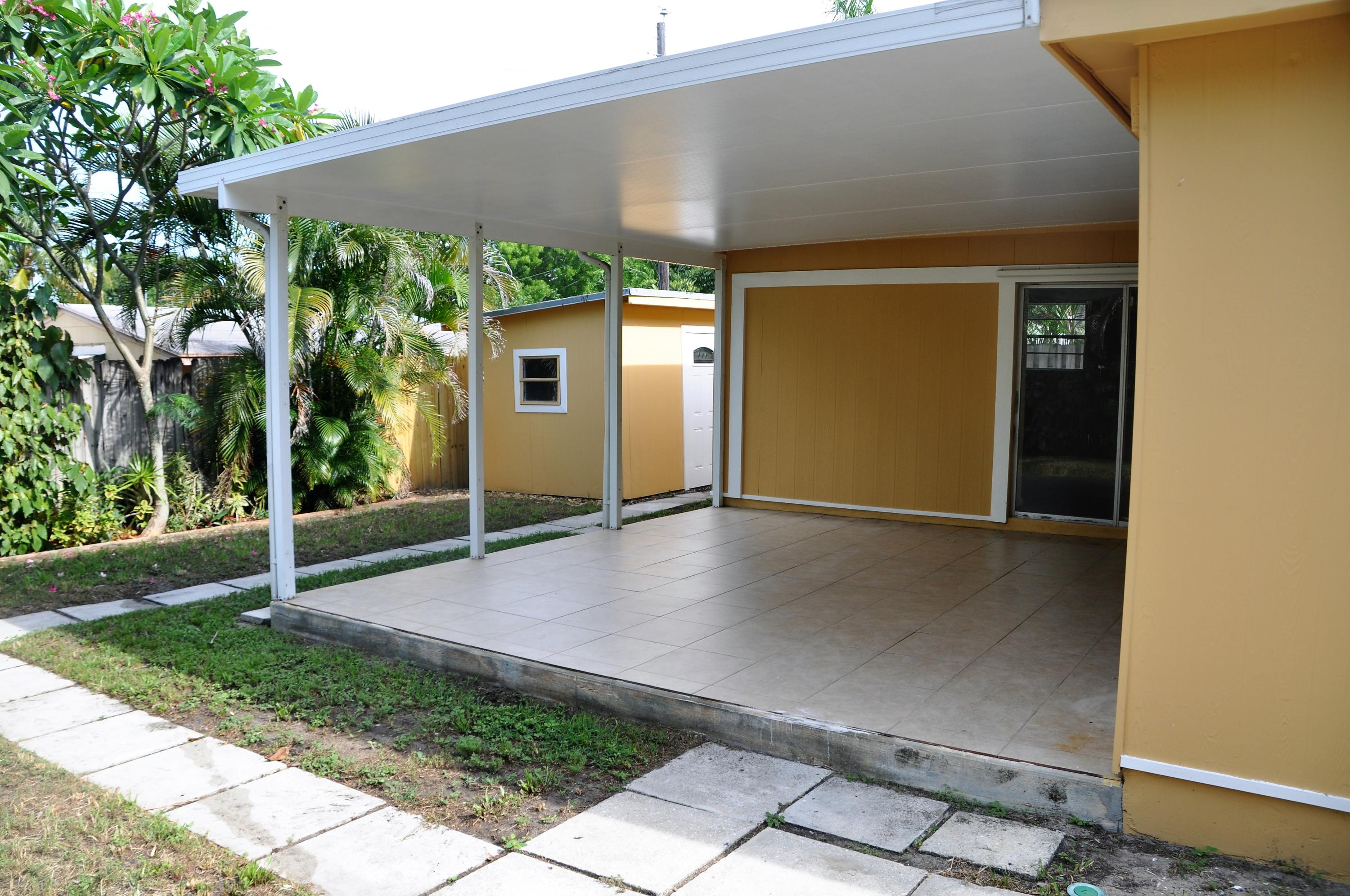 3025 Robert Road West Palm Beach, FL 33405 - Photo 13 of 41 a view of a house with backyard and garden
