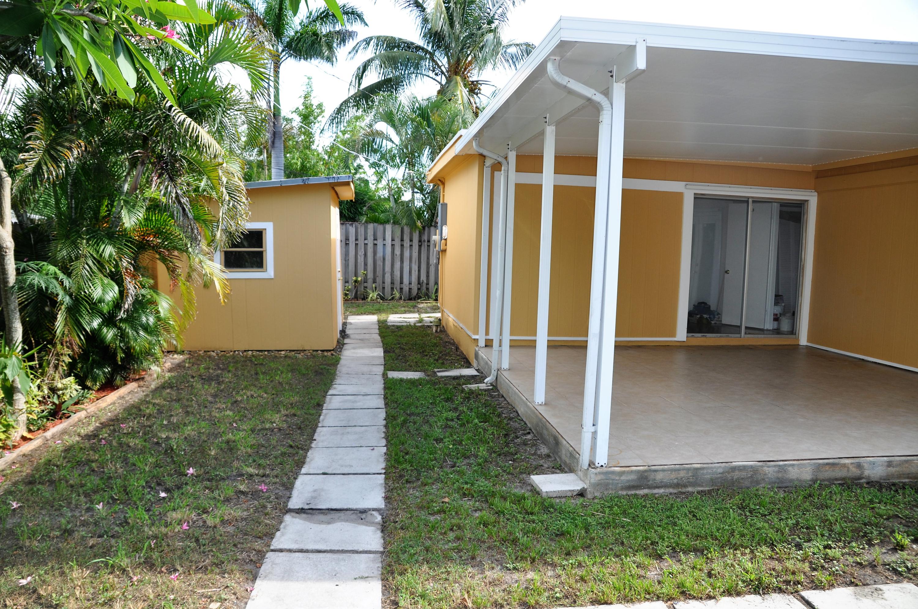 3025 Robert Road West Palm Beach, FL 33405 - Photo 14 of 41 a view of a house with backyard