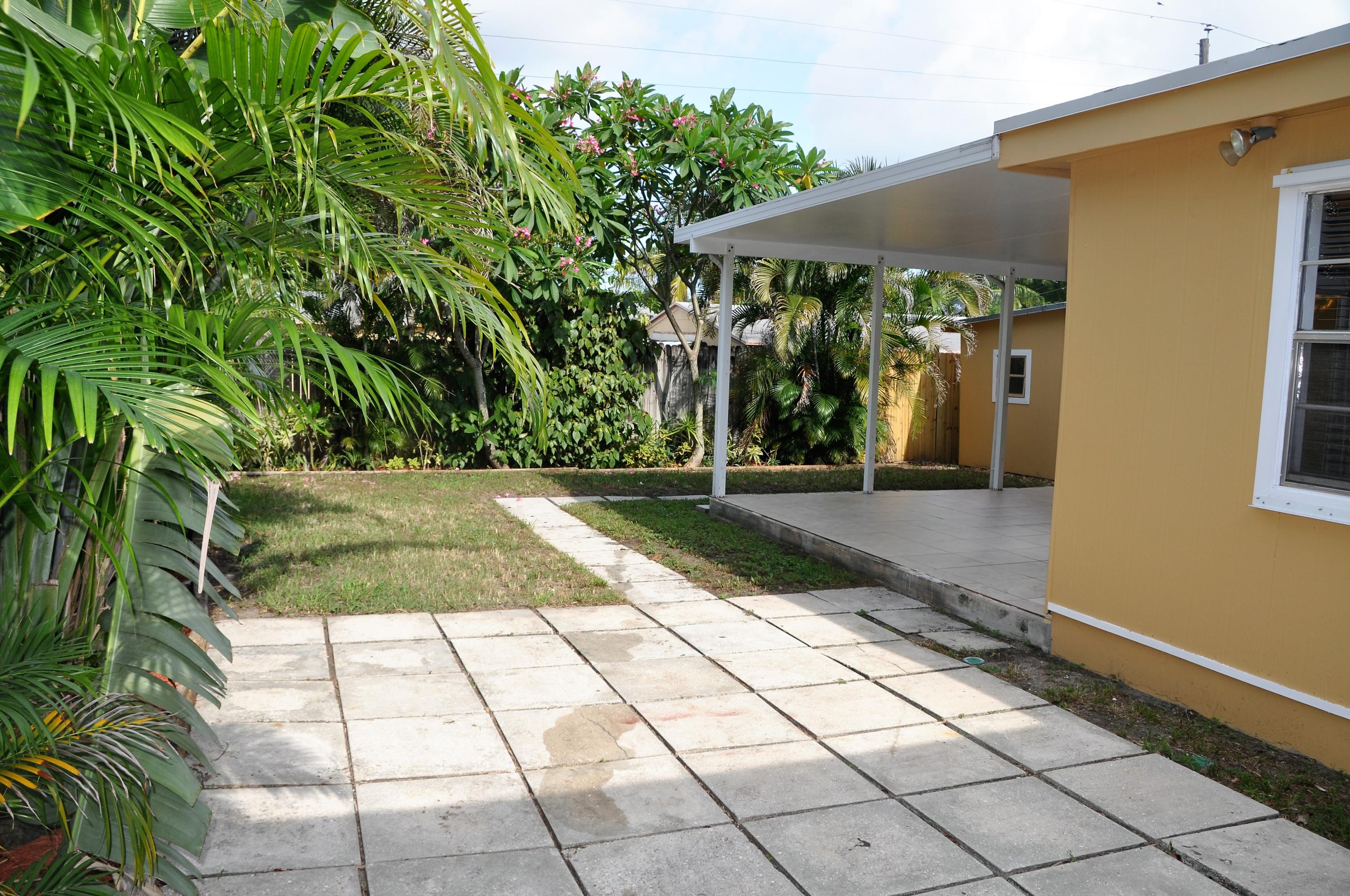 3025 Robert Road West Palm Beach, FL 33405 - Photo 16 of 41 a view of backyard with potted plants