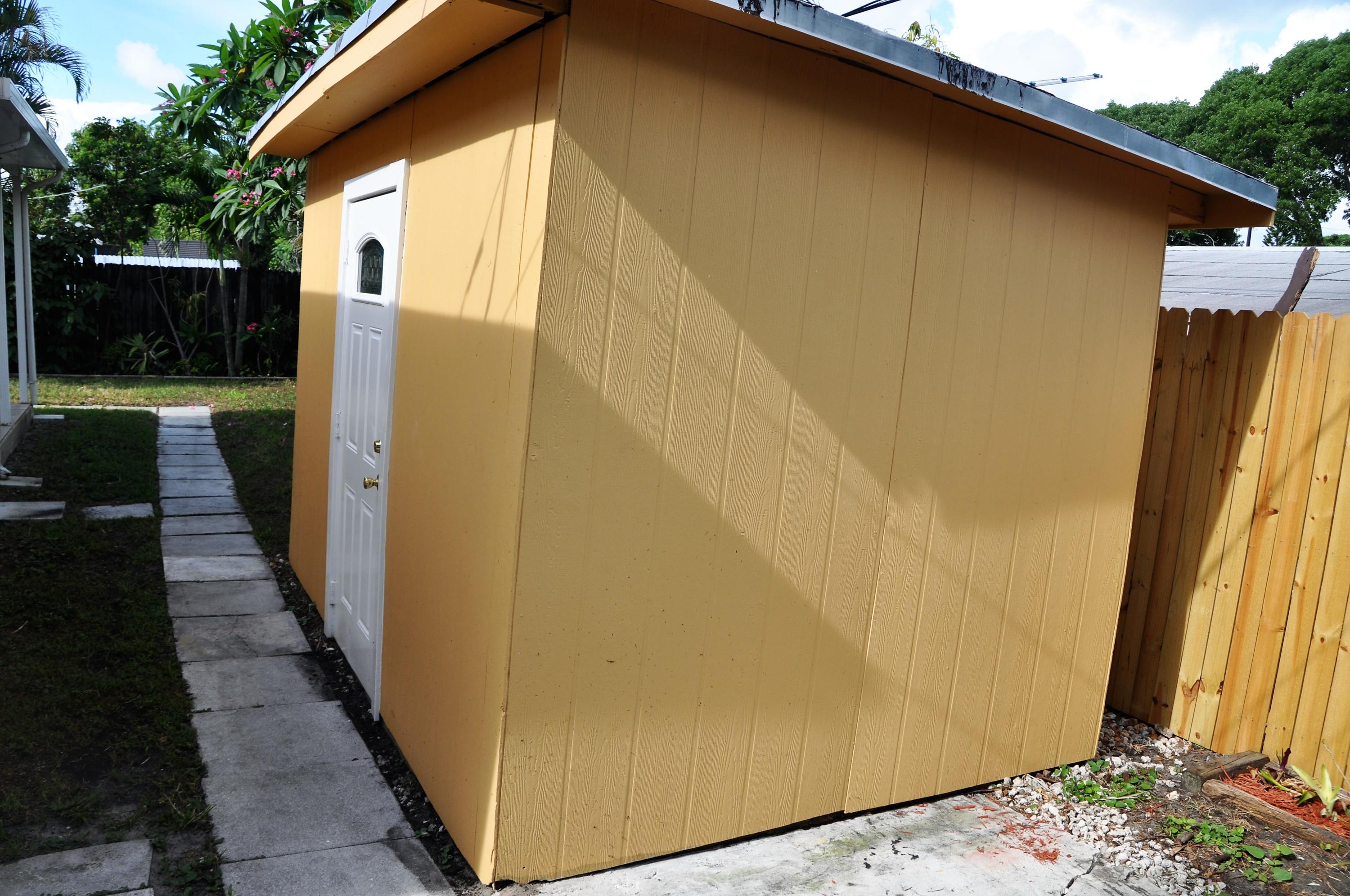 3025 Robert Road West Palm Beach, FL 33405 - Photo 17 of 41 a view of a door and wooden floor