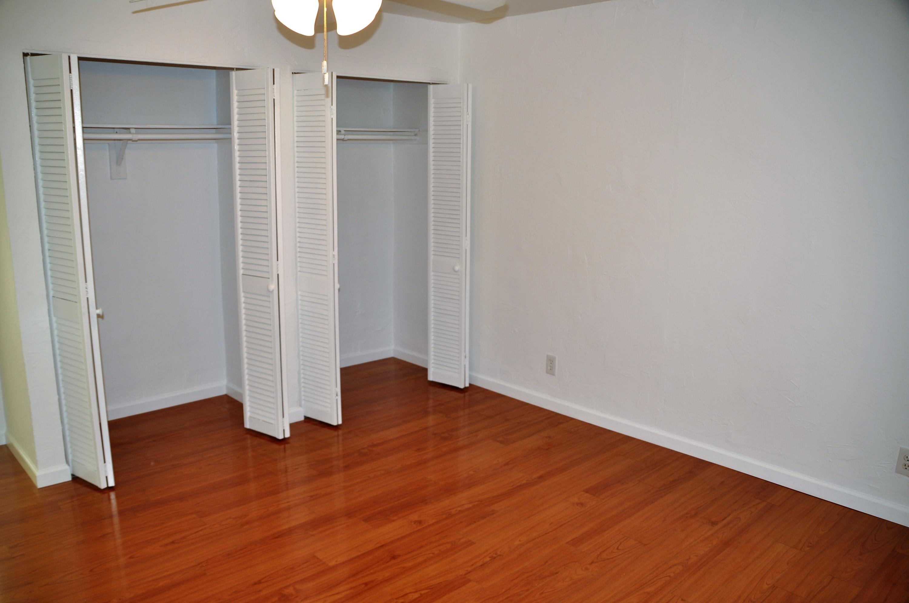 3025 Robert Road West Palm Beach, FL 33405 - Photo 20 of 41 an empty room with wooden floor and closet