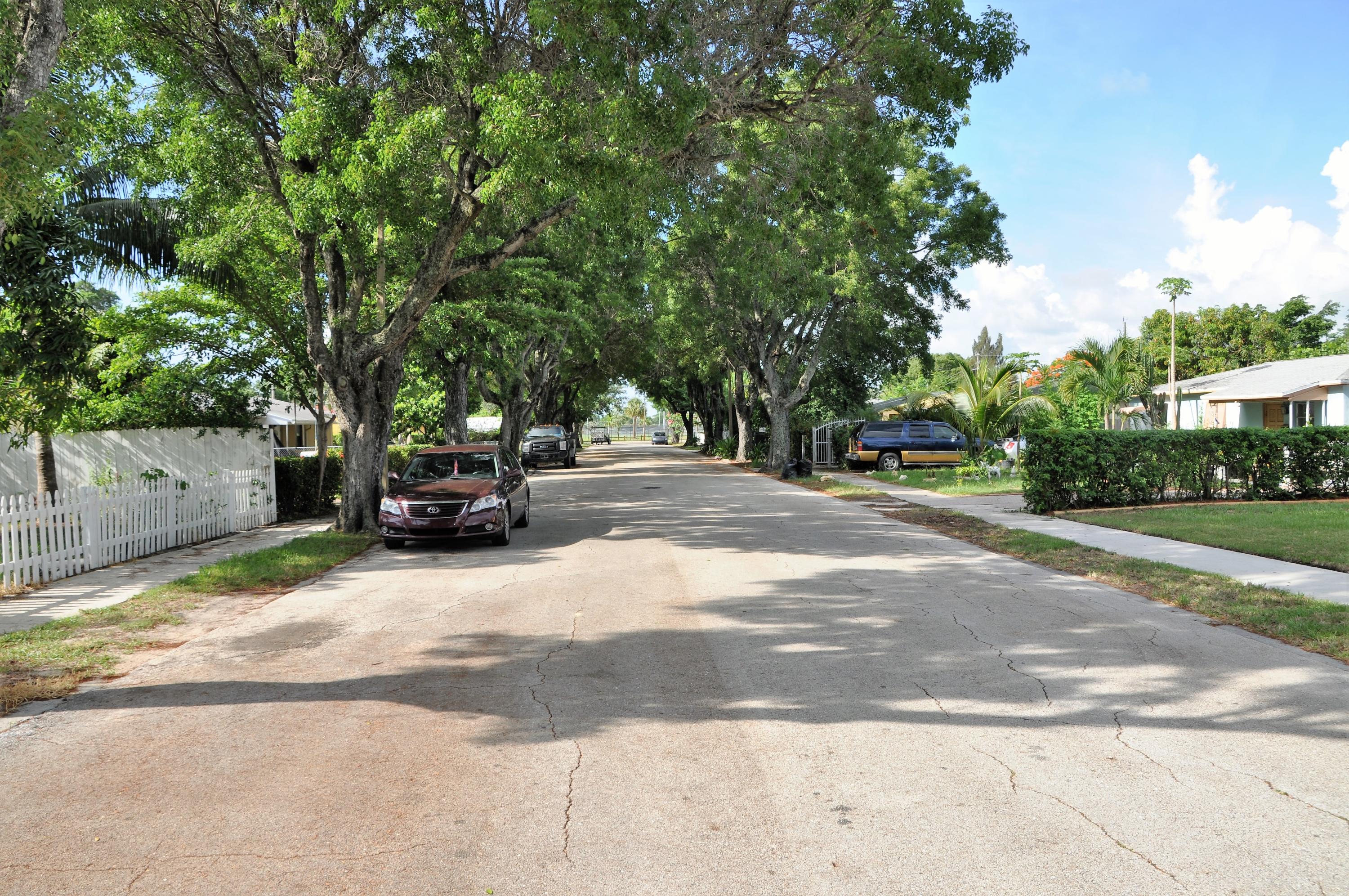 3025 Robert Road West Palm Beach, FL 33405 - Photo 2 of 41 a view of street with parked cars