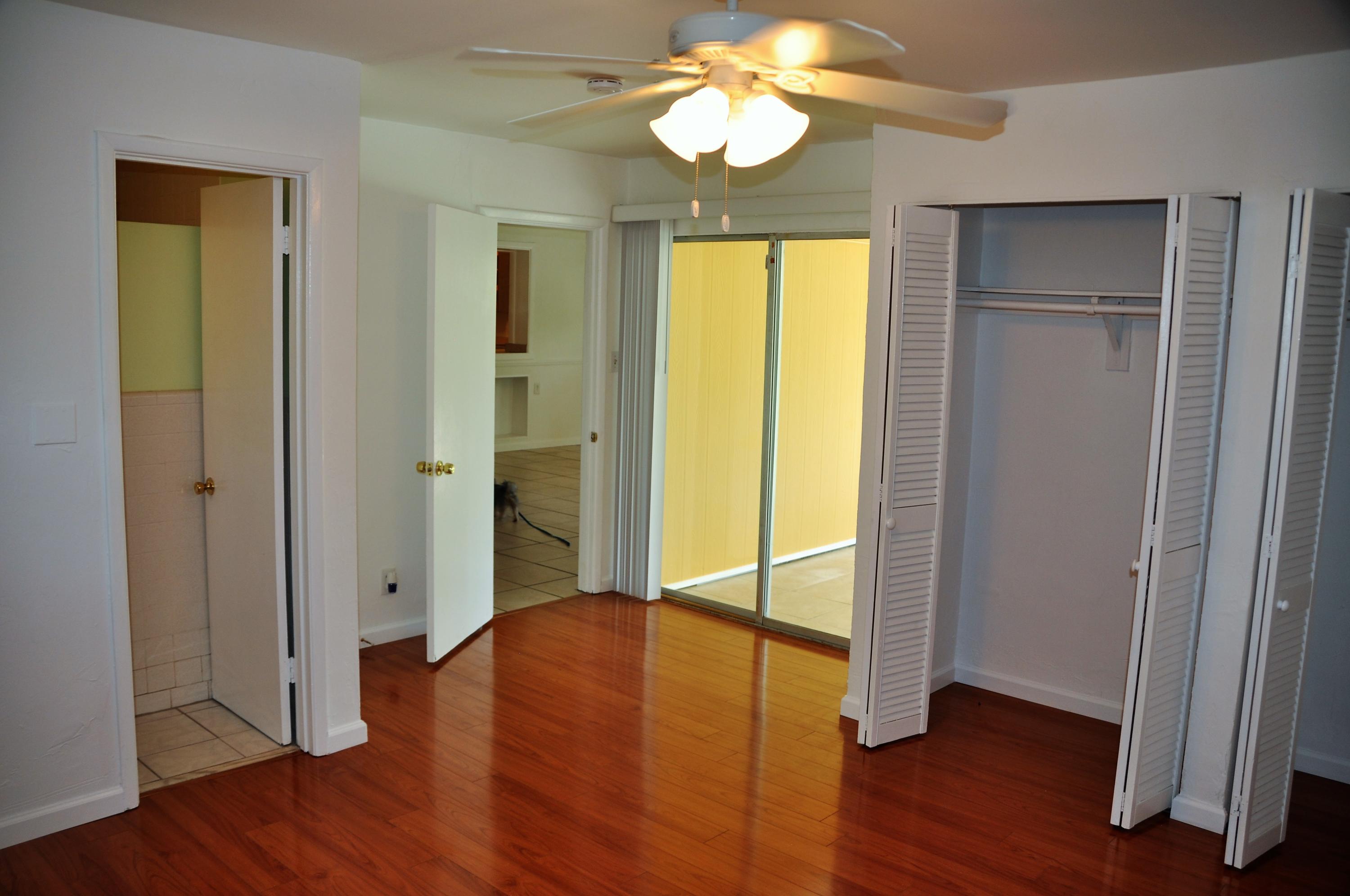 3025 Robert Road West Palm Beach, FL 33405 - Photo 22 of 41 a view of an empty room with wooden floor and a window