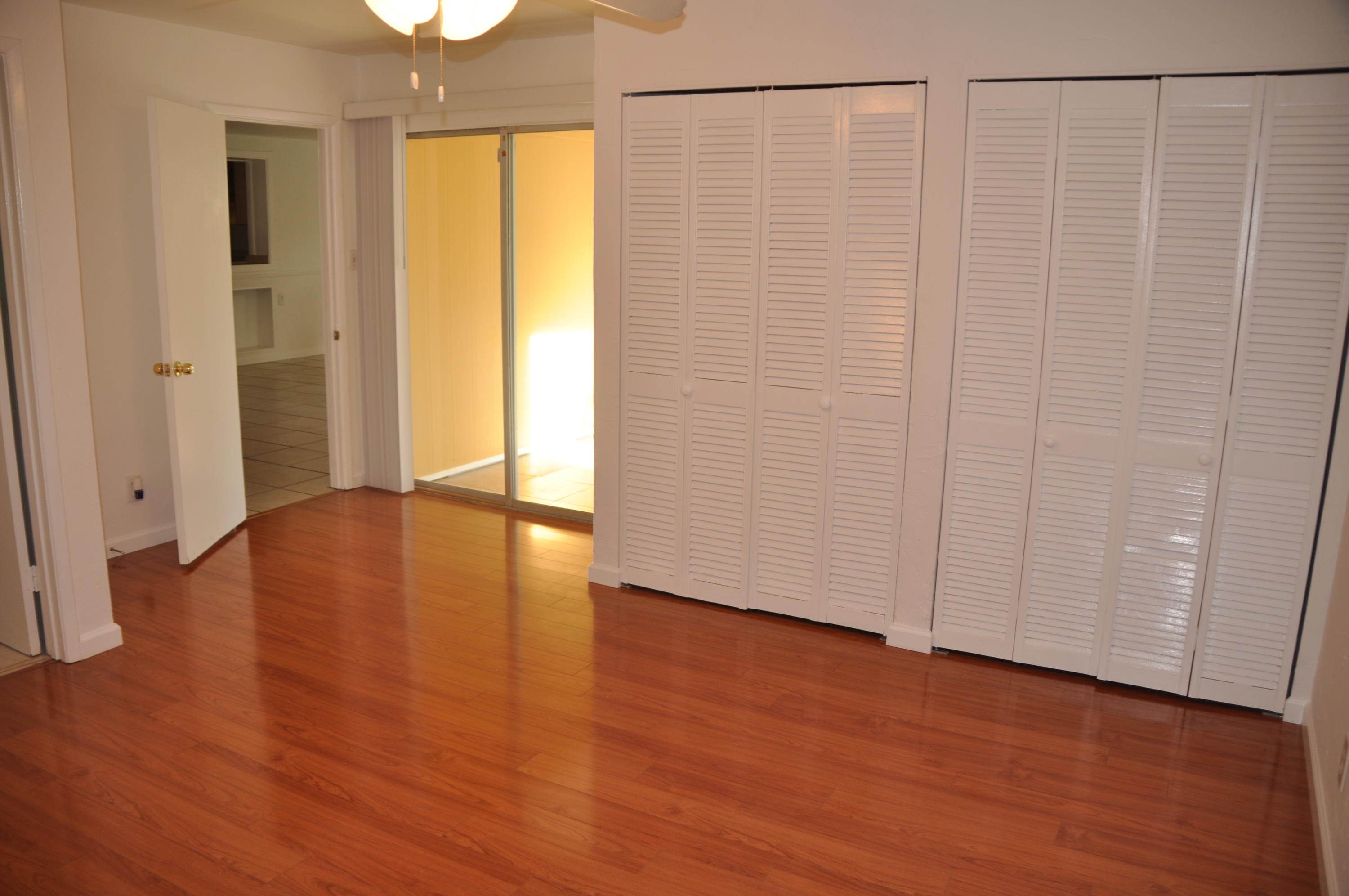 3025 Robert Road West Palm Beach, FL 33405 - Photo 23 of 41 a view of an empty room with wooden floor and a window