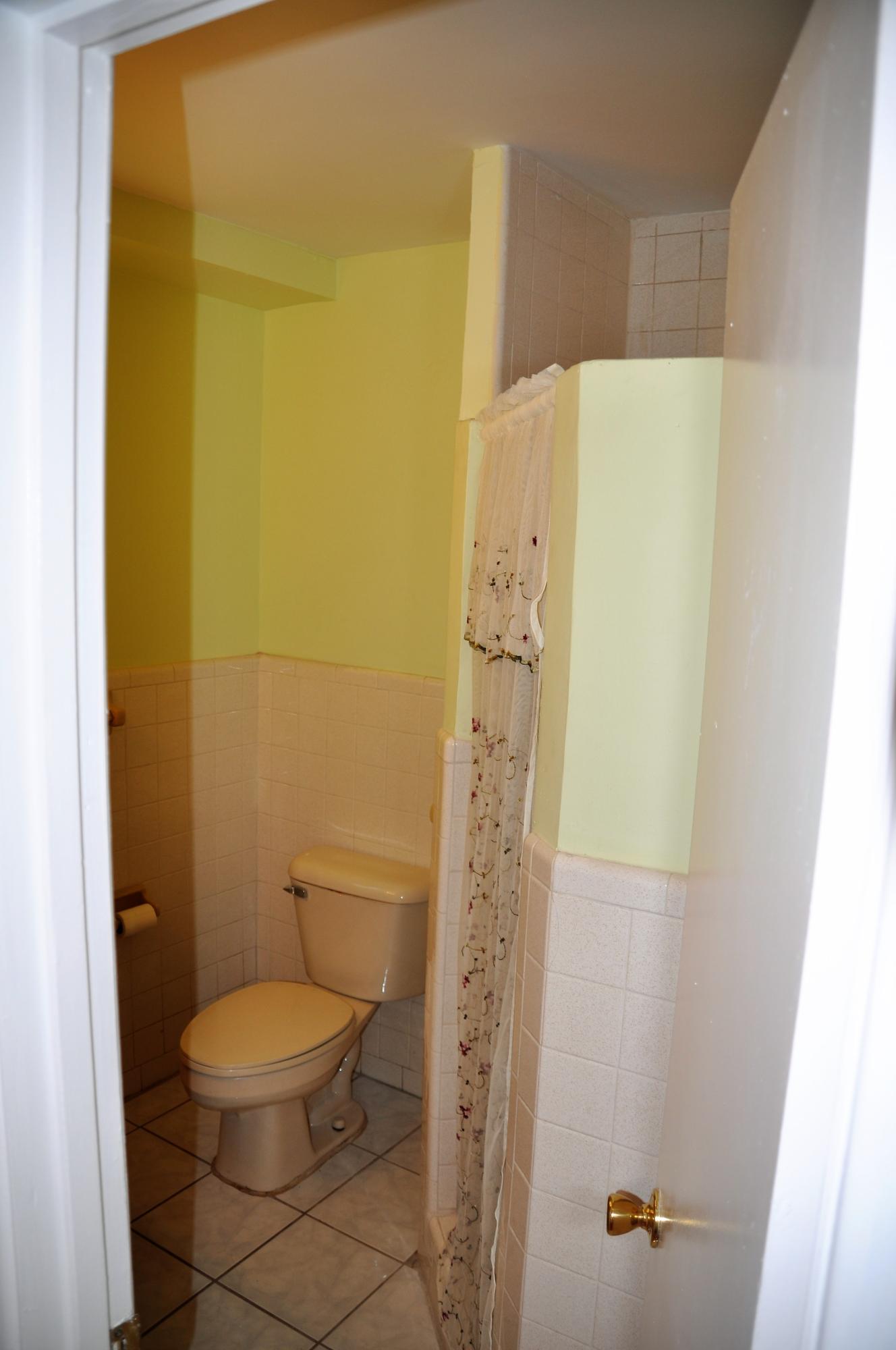 3025 Robert Road West Palm Beach, FL 33405 - Photo 25 of 41 a bathroom with a toilet and shower